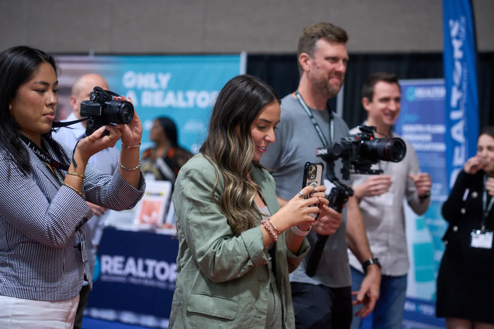Social media management experts of Home Show Media capture a moment of an exhibitor at the Home Design and Remodeling Show.